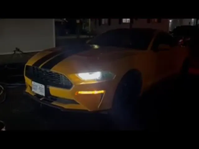 Yellow Ford Mustang night walkaround after detail